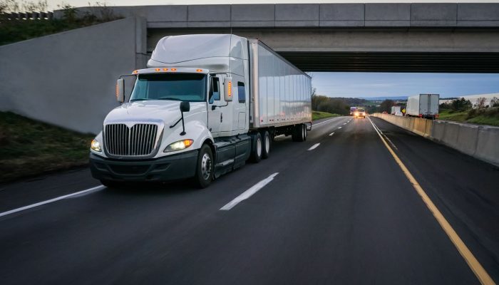 Semi-truck,Commercial,Vehicle,18,Wheeler,On,Highway,With,Overpass