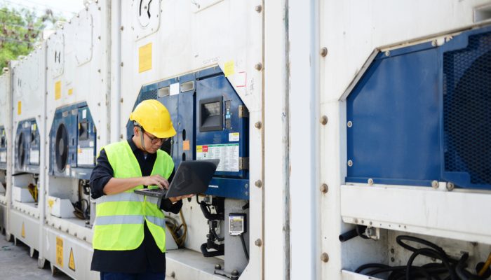 Asian,Man,Reefer,Technician,Is,Seriously,Working,And,Monitoring,Reefer